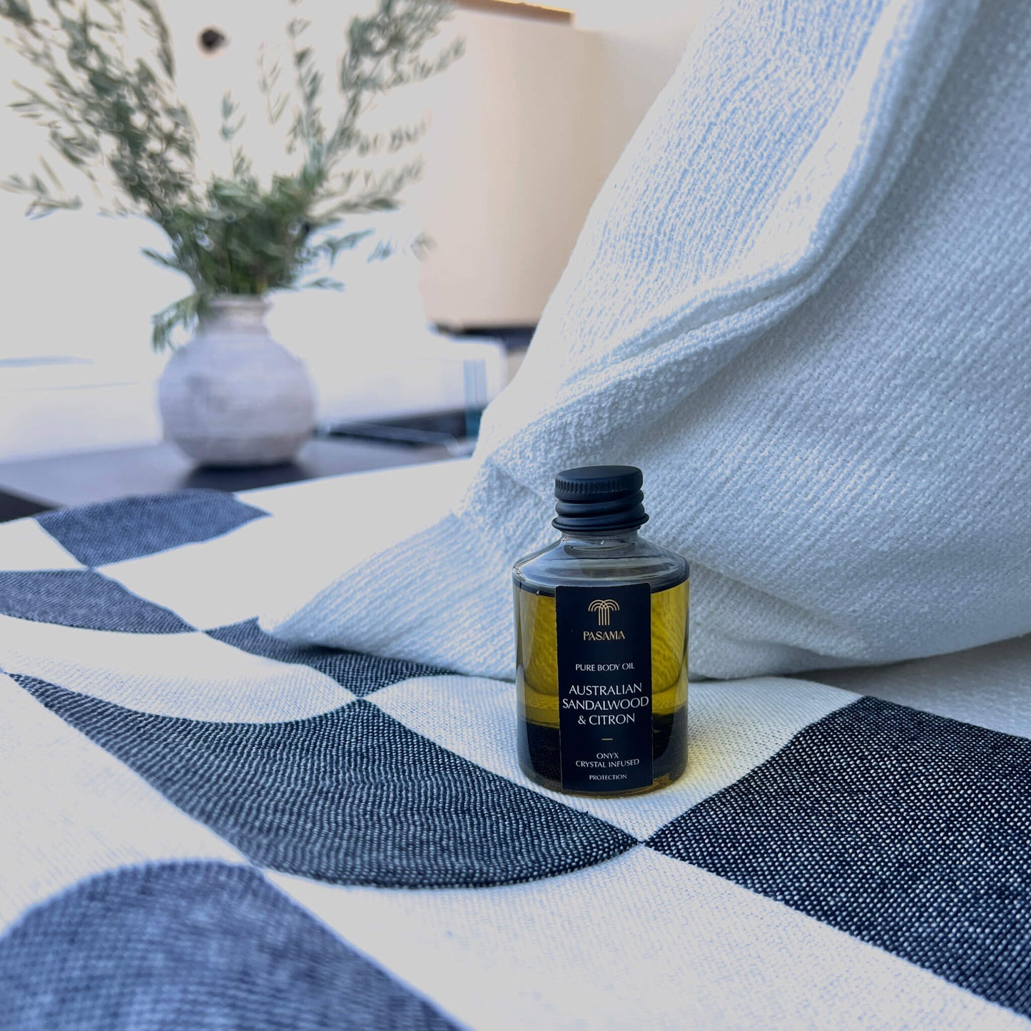 Travel size body oil poolside 